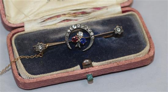 A late Victorian yellow metal, ruby, sapphire and diamond set crescent and shamrock bar brooch, 46mm.